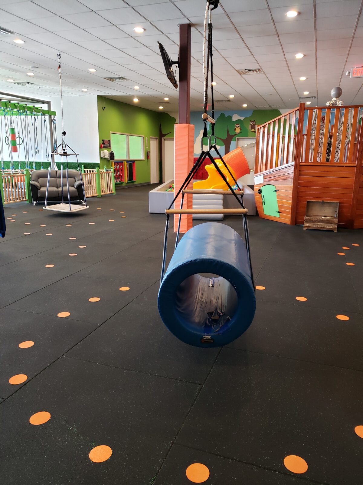 Suspended barrel sensory swing in the Waco therapy gym